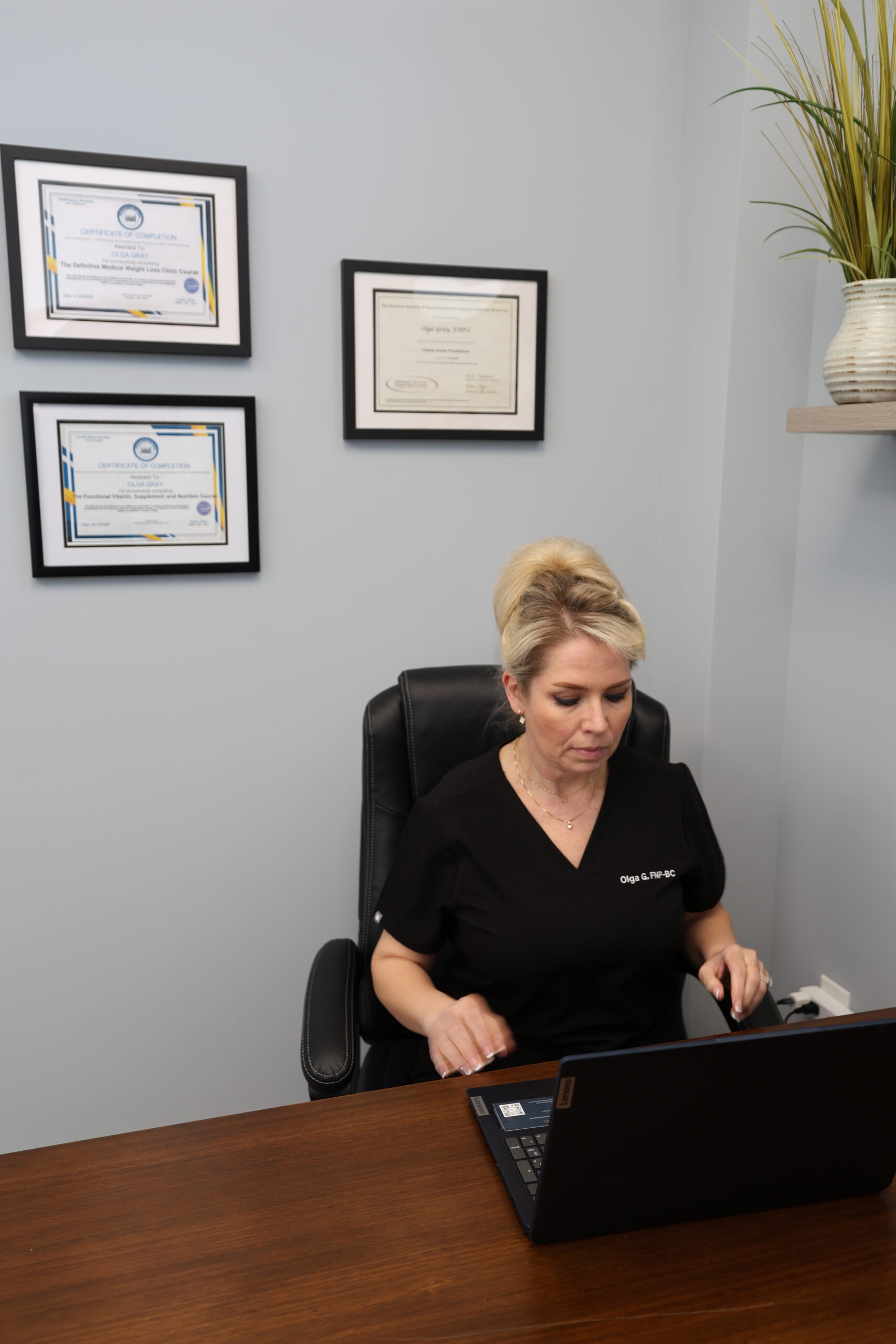 Olga Gray, FNP-BC at her desk in the Cornelius clinic